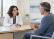 Doctor listening to a patient during a pain clinic consultation.