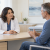 Doctor listening to a patient during a pain clinic consultation.